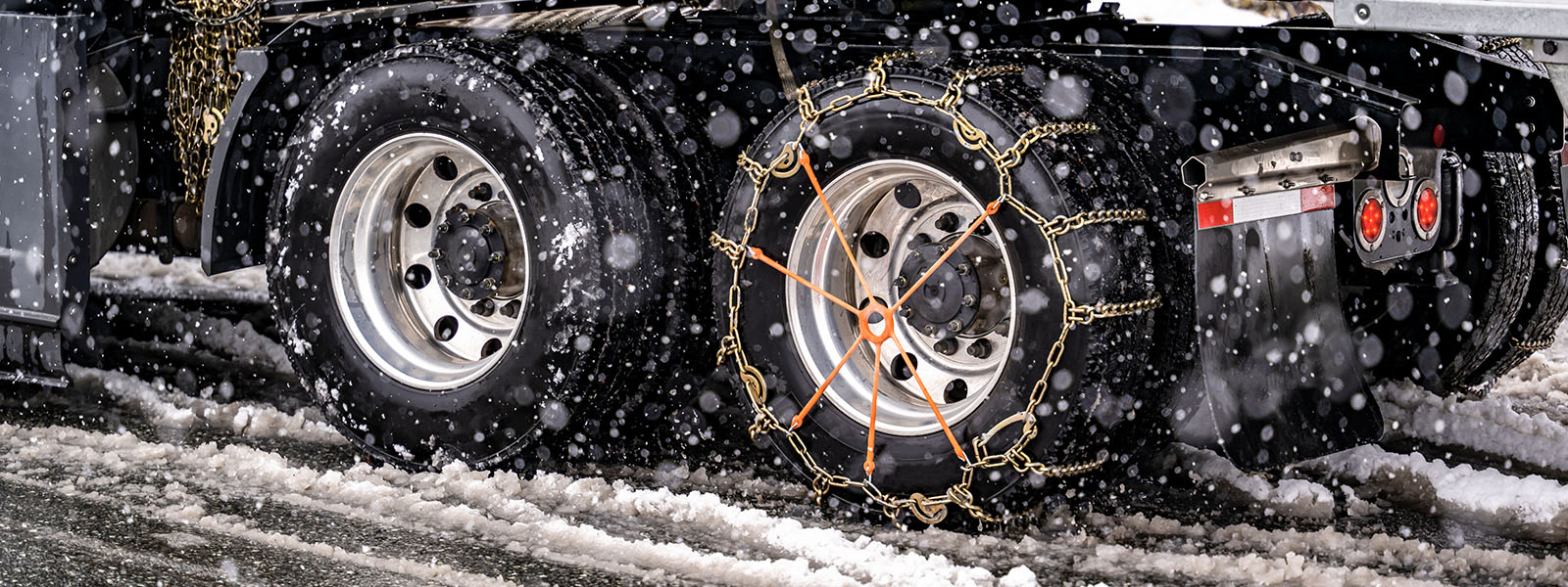 snow chains on semi truck wheels